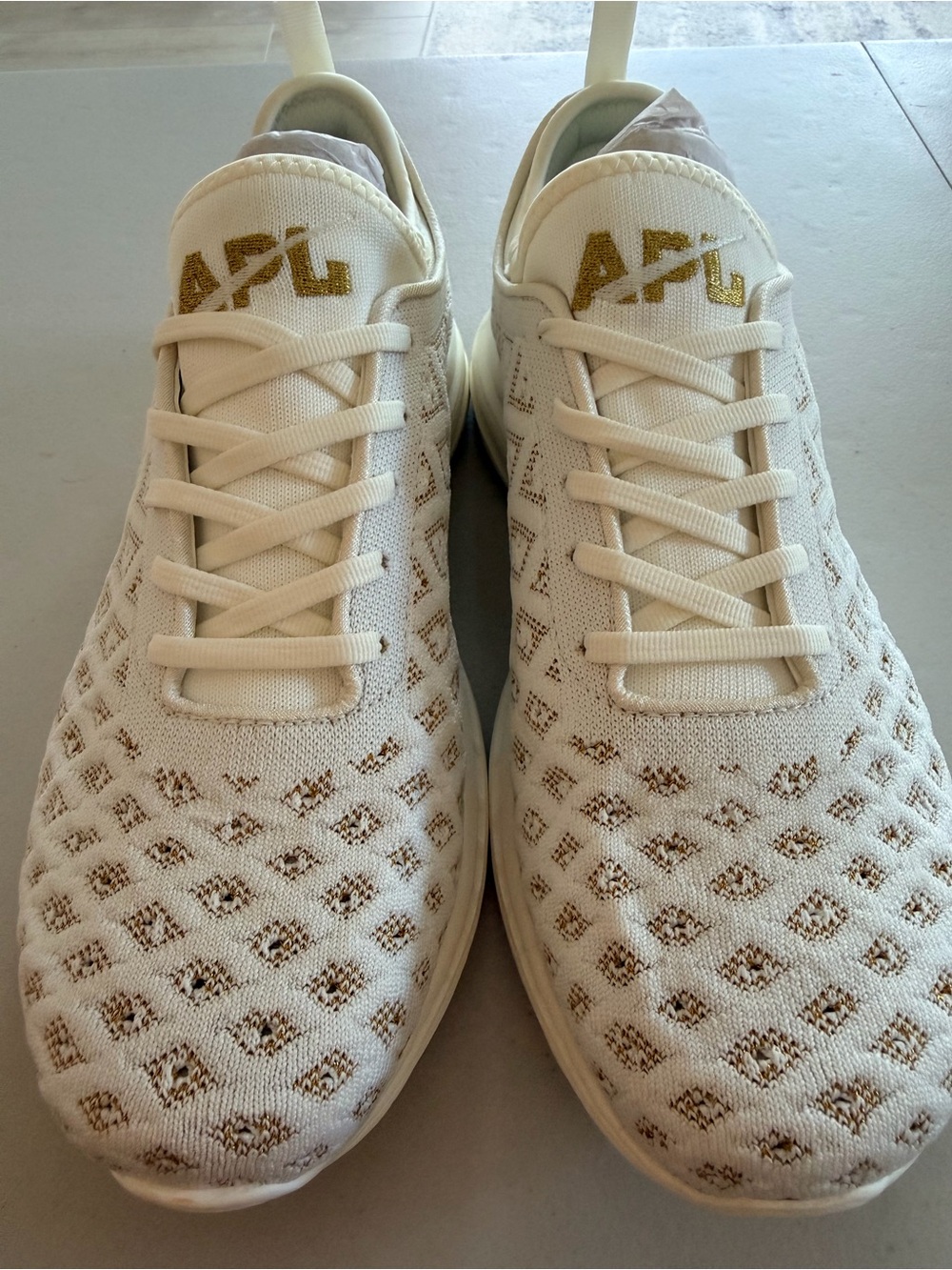APL Men’s Knit Sneakers in White and Gold Accent